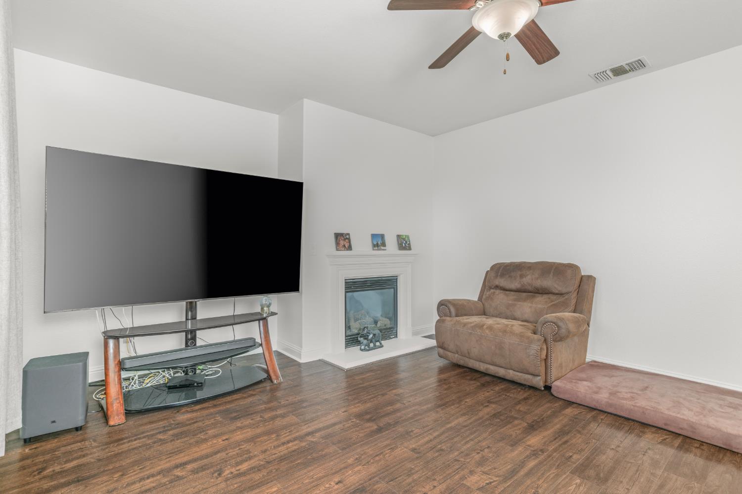 3815 Lee Brook Way Sacramento, CA 95838 - Photo 17 of 43 a living room with furniture and a flat screen tv
