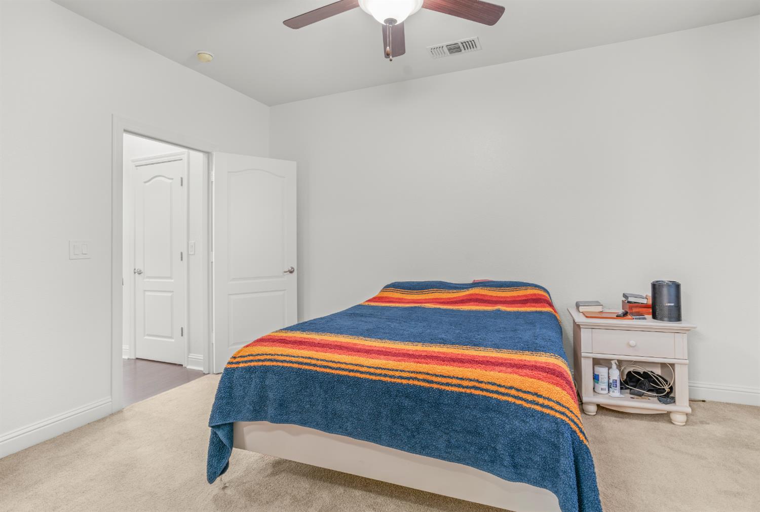 3815 Lee Brook Way Sacramento, CA 95838 - Photo 20 of 43 a bedroom with a bed and a chandelier