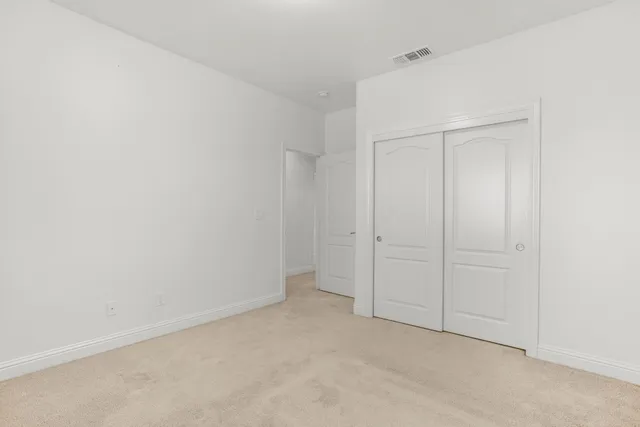 a front view of house with a garden and patio