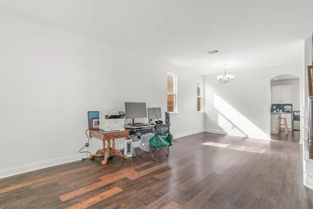 a workspace with furniture and wooden floor