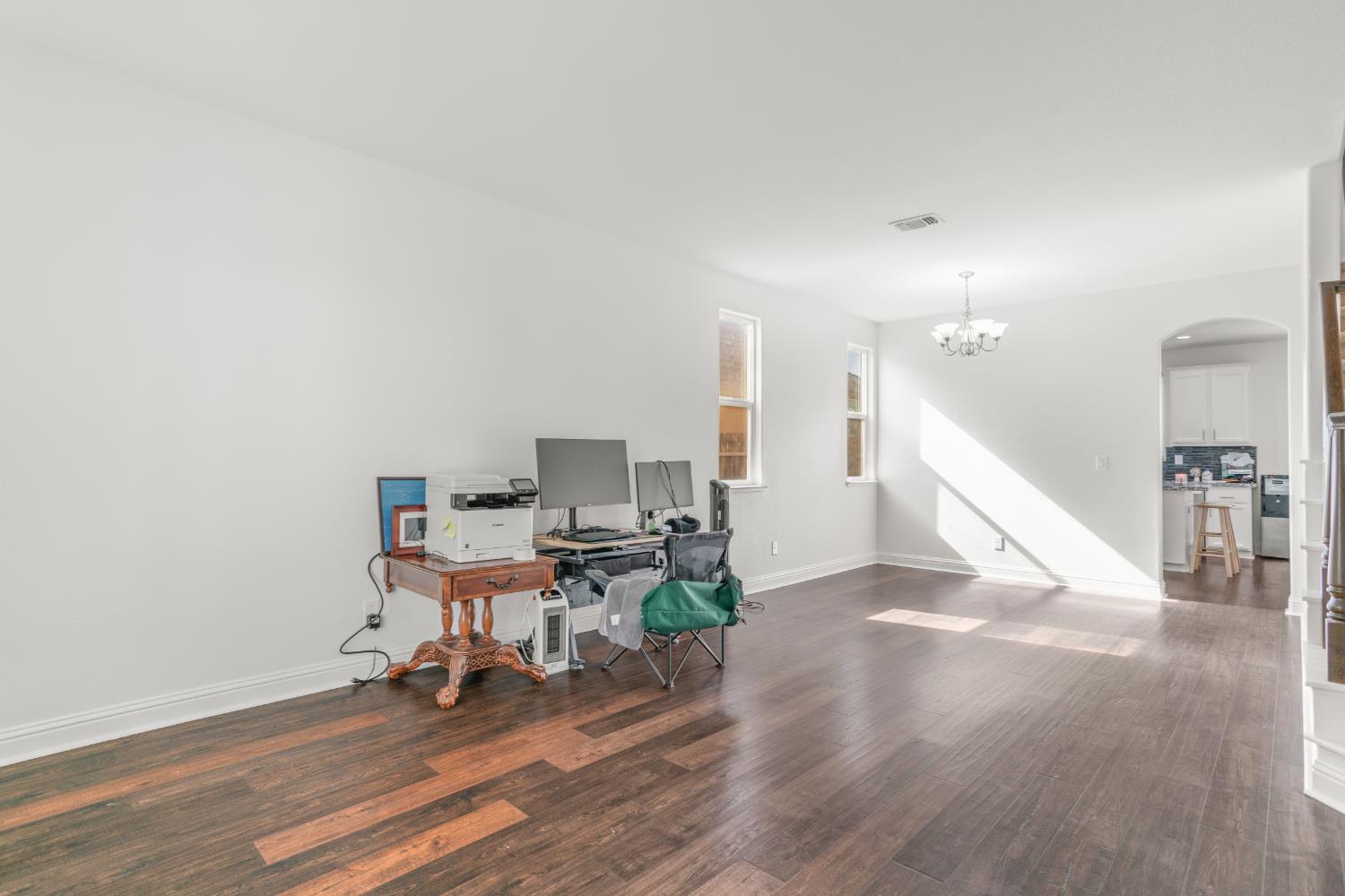 3815 Lee Brook Way Sacramento, CA 95838 - Photo 4 of 43 a workspace with furniture and wooden floor