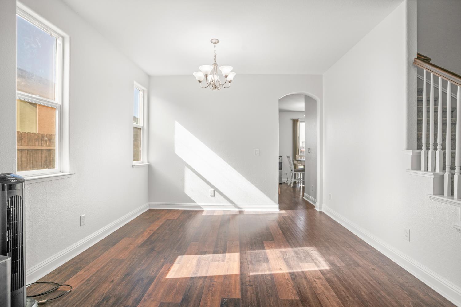 3815 Lee Brook Way Sacramento, CA 95838 - Photo 8 of 43 wooden floor in an empty room with a window