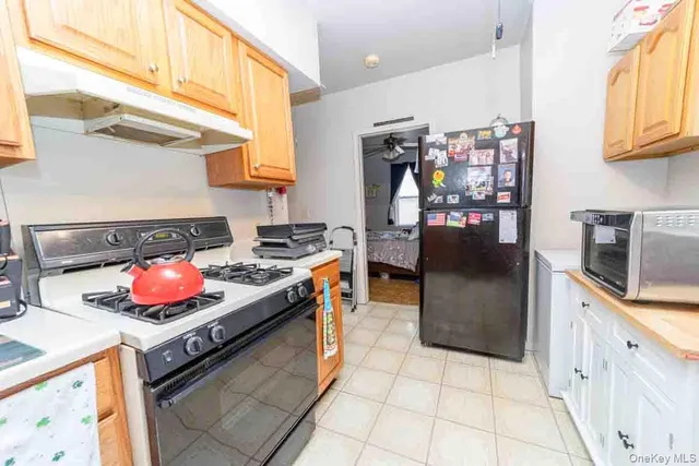 a kitchen with stainless steel appliances granite countertop a stove and a refrigerator