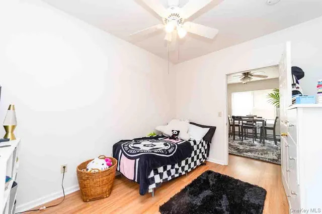 a bedroom with furniture and a chandelier
