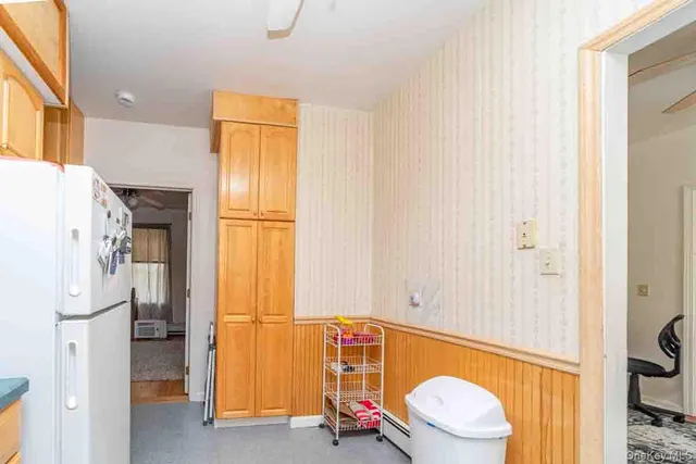 a bathroom with a tub and toilet