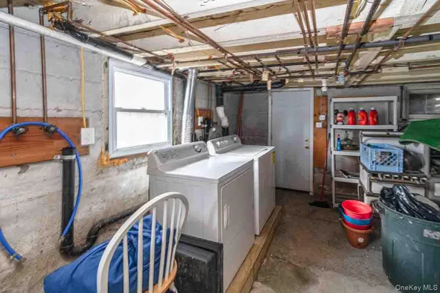 a utility room with two washing machine