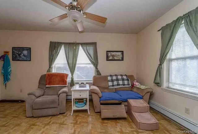 a living room with furniture and a window