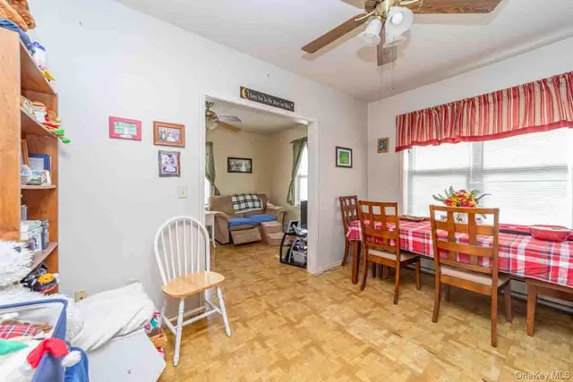 a room with furniture a rug and a window