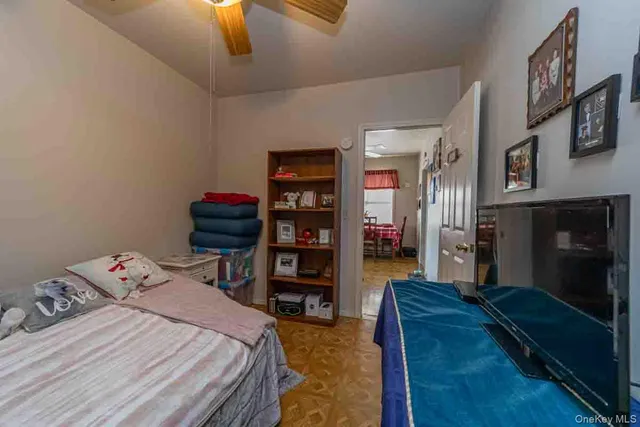 a bed room with a bed and a television