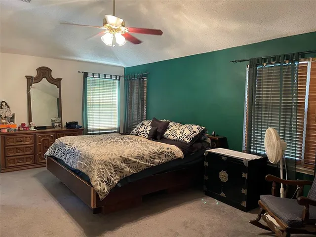 a bathroom with a tub sink and a mirror