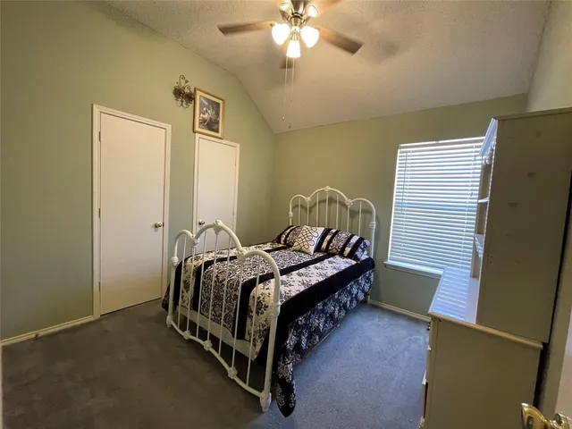 a view of a livingroom with workspace and a window