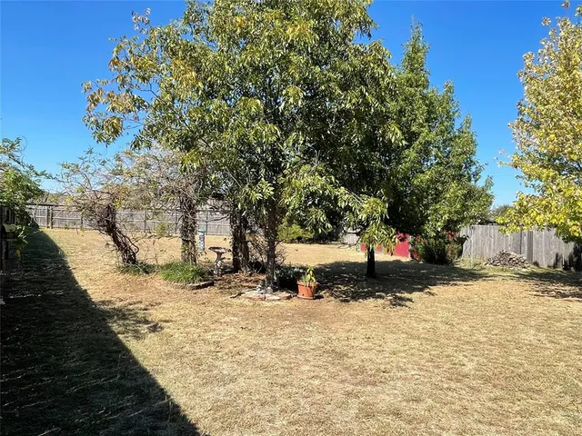 a view of a backyard of the house