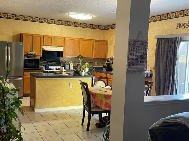 a view of a dining room with furniture and a table