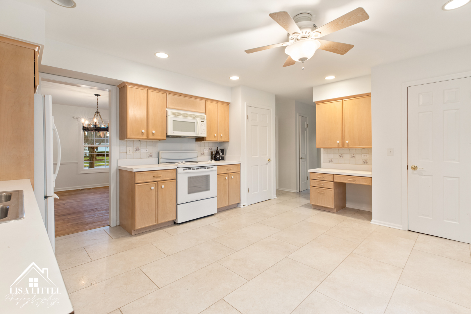 6S230 Concord Road Naperville, IL 60540 - Photo 11 of 42 a kitchen with a stove a sink and a refrigerator
