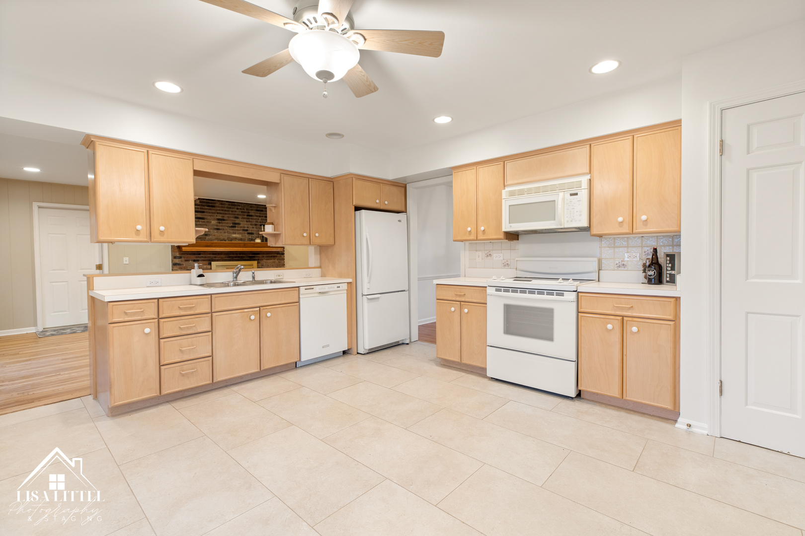 6S230 Concord Road Naperville, IL 60540 - Photo 13 of 42 a kitchen with white cabinets stainless steel appliances and sink