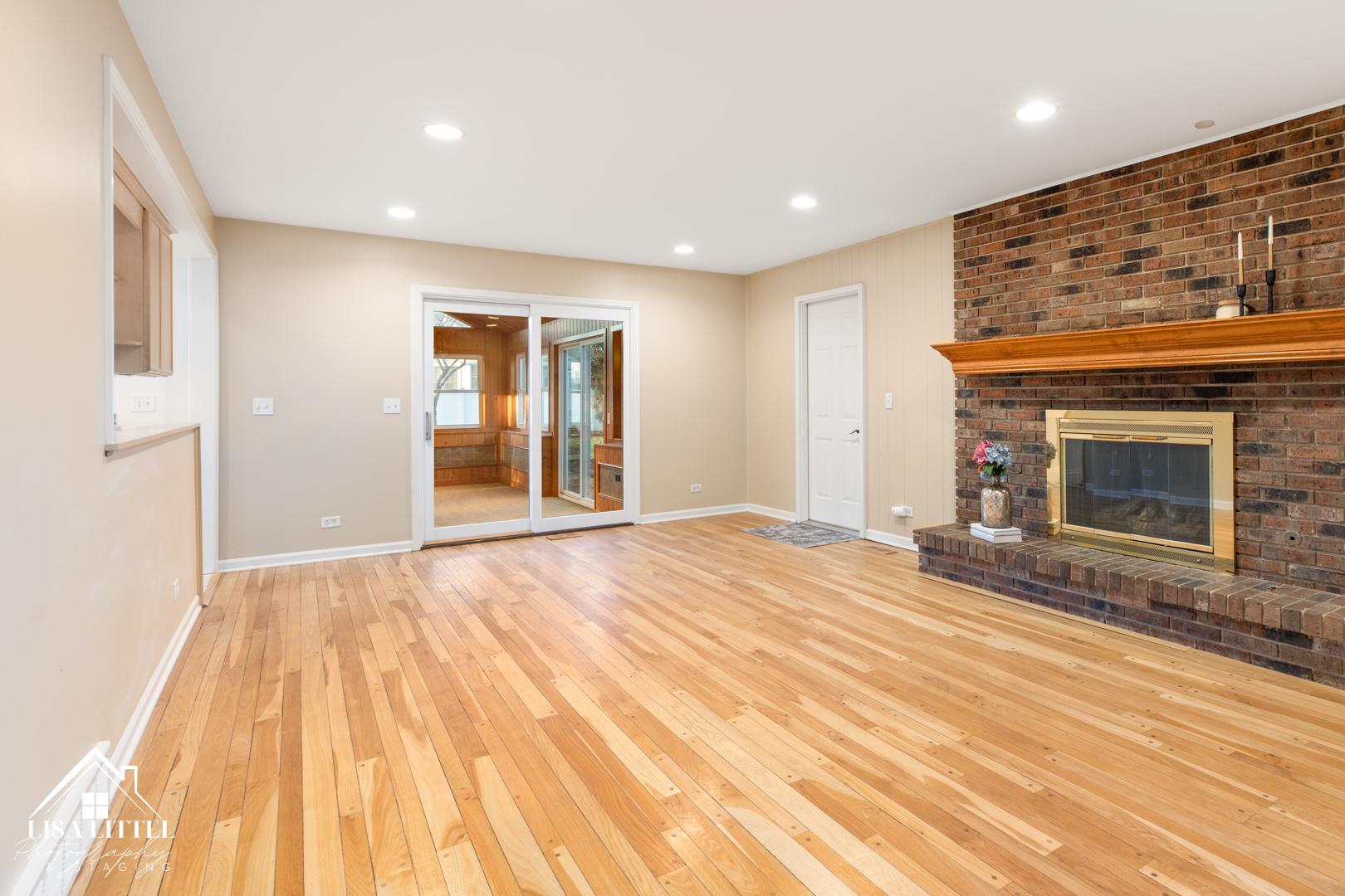 6S230 Concord Road Naperville, IL 60540 - Photo 17 of 42 a view of empty room with wooden floor and fireplace