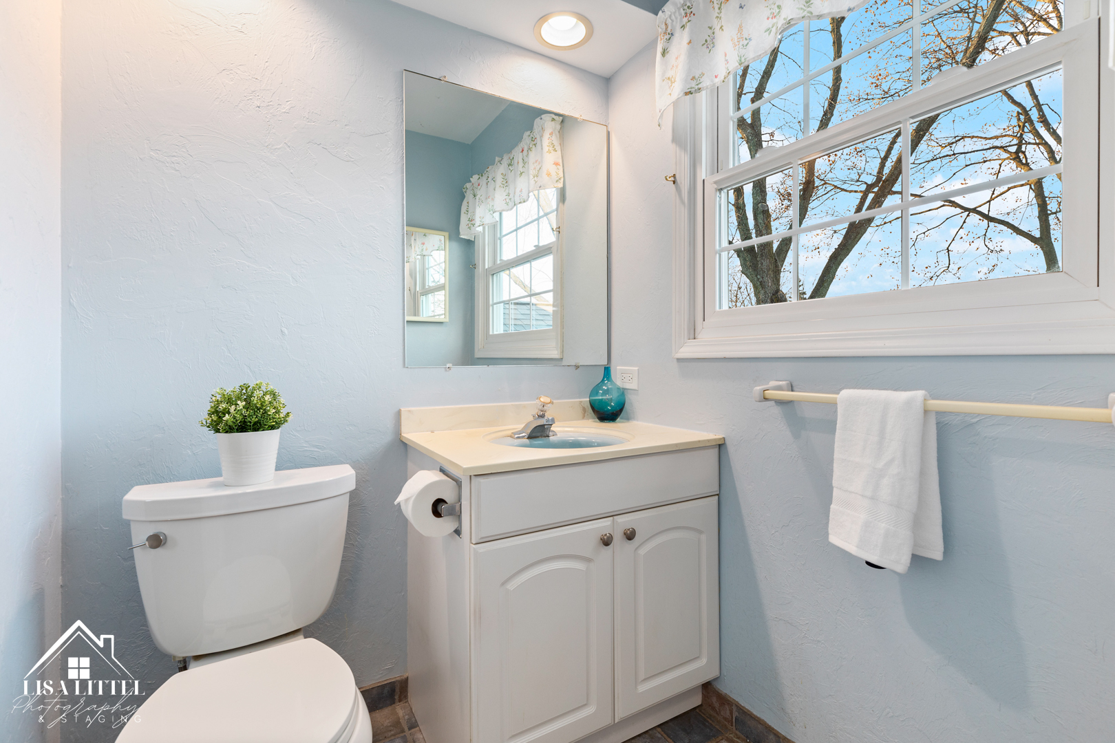 6S230 Concord Road Naperville, IL 60540 - Photo 27 of 42 a bathroom with a granite countertop toilet sink and mirror