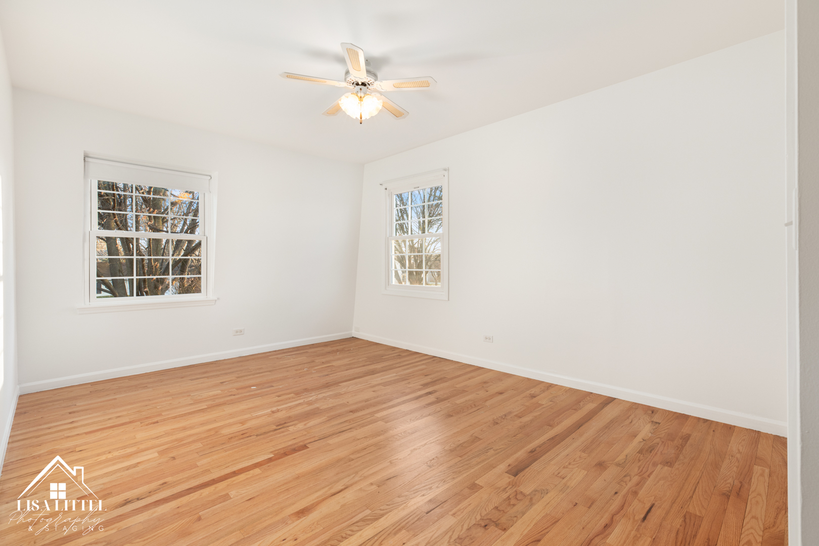 6S230 Concord Road Naperville, IL 60540 - Photo 31 of 42 a view of an empty room with wooden floor and a window
