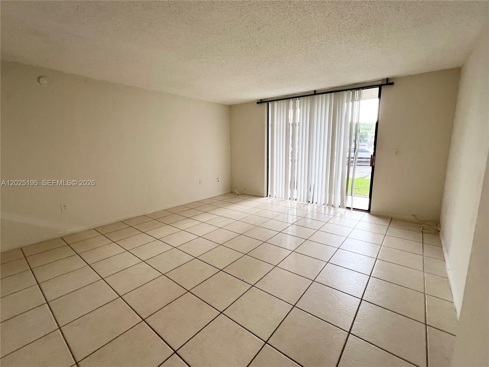 8400 Southwest 133rd Avenue Road, Unit 121 Miami, FL 33183 - Photo 40 of 43 a view of an empty room and window