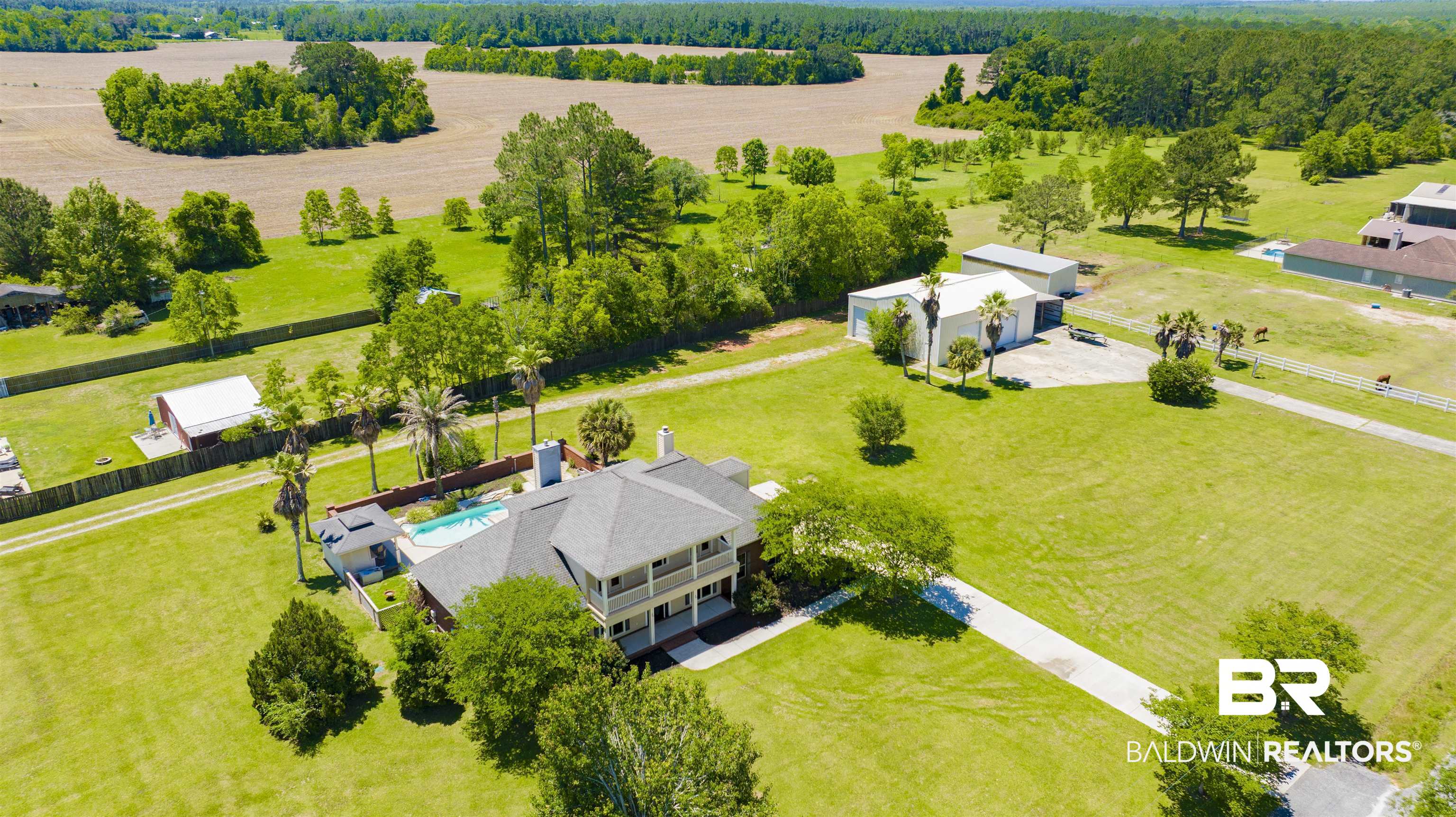 12944 Anna's Way Stapleton, AL 36578 - Photo 4 of 64 Expansive property featuring a multi-level residence, private swimming pool, detached garage, and vast green spaces