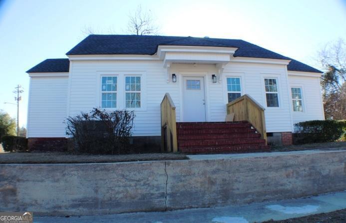 1007 Burch Street Cadwell, GA 31009 - Photo 1 of 25 a front view of a house with garden
