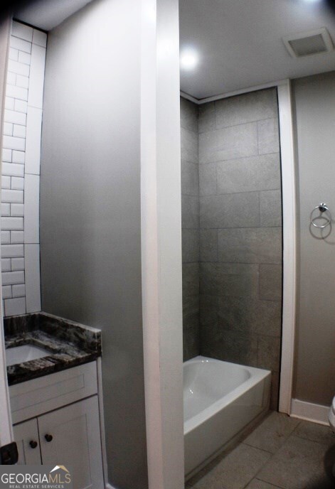 1007 Burch Street Cadwell, GA 31009 - Photo 19 of 25 a bathroom with a granite countertop sink a toilet and bathtub
