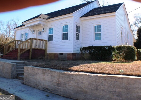 1007 Burch Street Cadwell, GA 31009 - Photo 2 of 25 a front view of a house with a yard