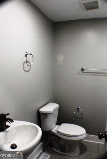 1007 Burch Street Cadwell, GA 31009 - Photo 21 of 25 a bathroom with a toilet and a sink