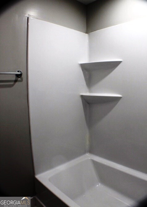 1007 Burch Street Cadwell, GA 31009 - Photo 22 of 25 a bathroom with a bathtub