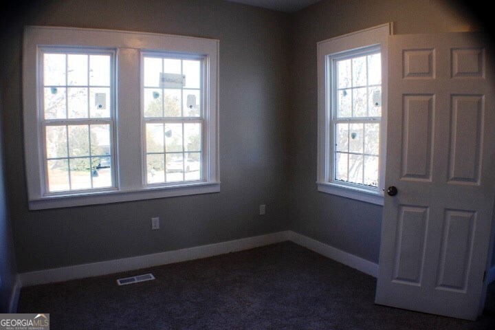 1007 Burch Street Cadwell, GA 31009 - Photo 23 of 25 an empty room with a window
