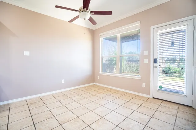 a view of an empty room and window