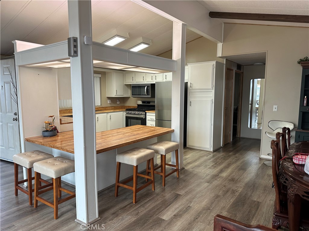 27701 Murrieta Road, Unit 268 Menifee, CA 92586 - Photo 7 of 24 a kitchen with a table and chairs in it