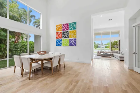 a view of a livingroom with furniture and floor to ceiling window
