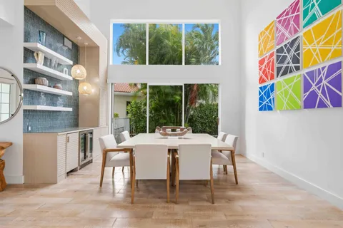 a living room with a flat screen tv and a window