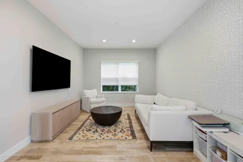 a kitchen with stainless steel appliances a stove a sink and a refrigerator