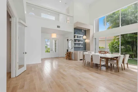 a living room with fireplace furniture and a floor to ceiling window