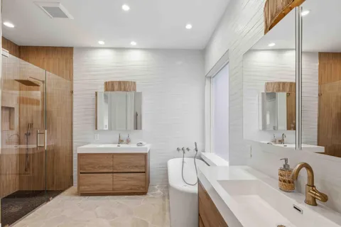 a bathroom with a sink toilet and shower