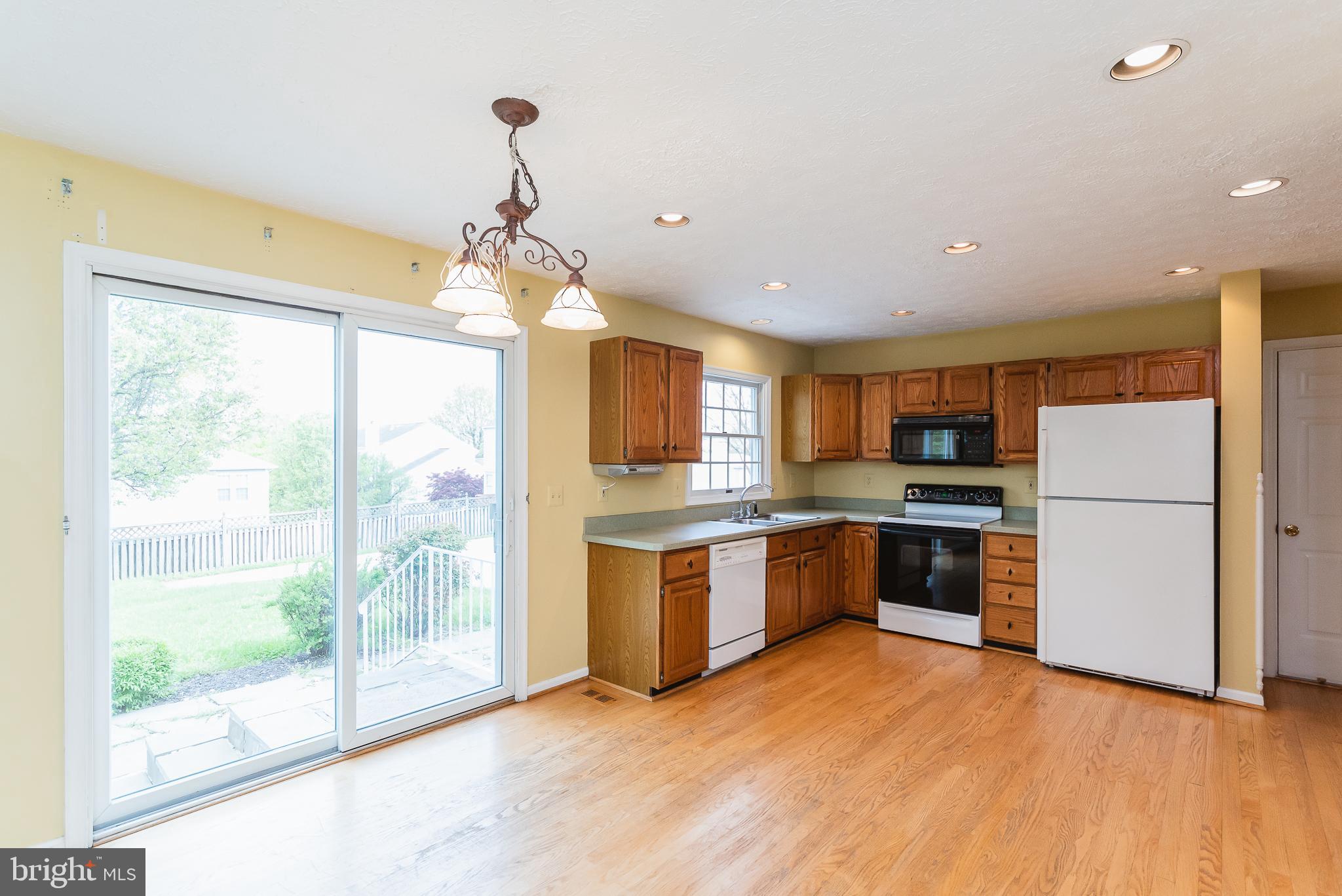 9202 Bretton Reef Road Baltimore, MD 21234 - Photo 10 of 54 Kitchen features sliders to back patio