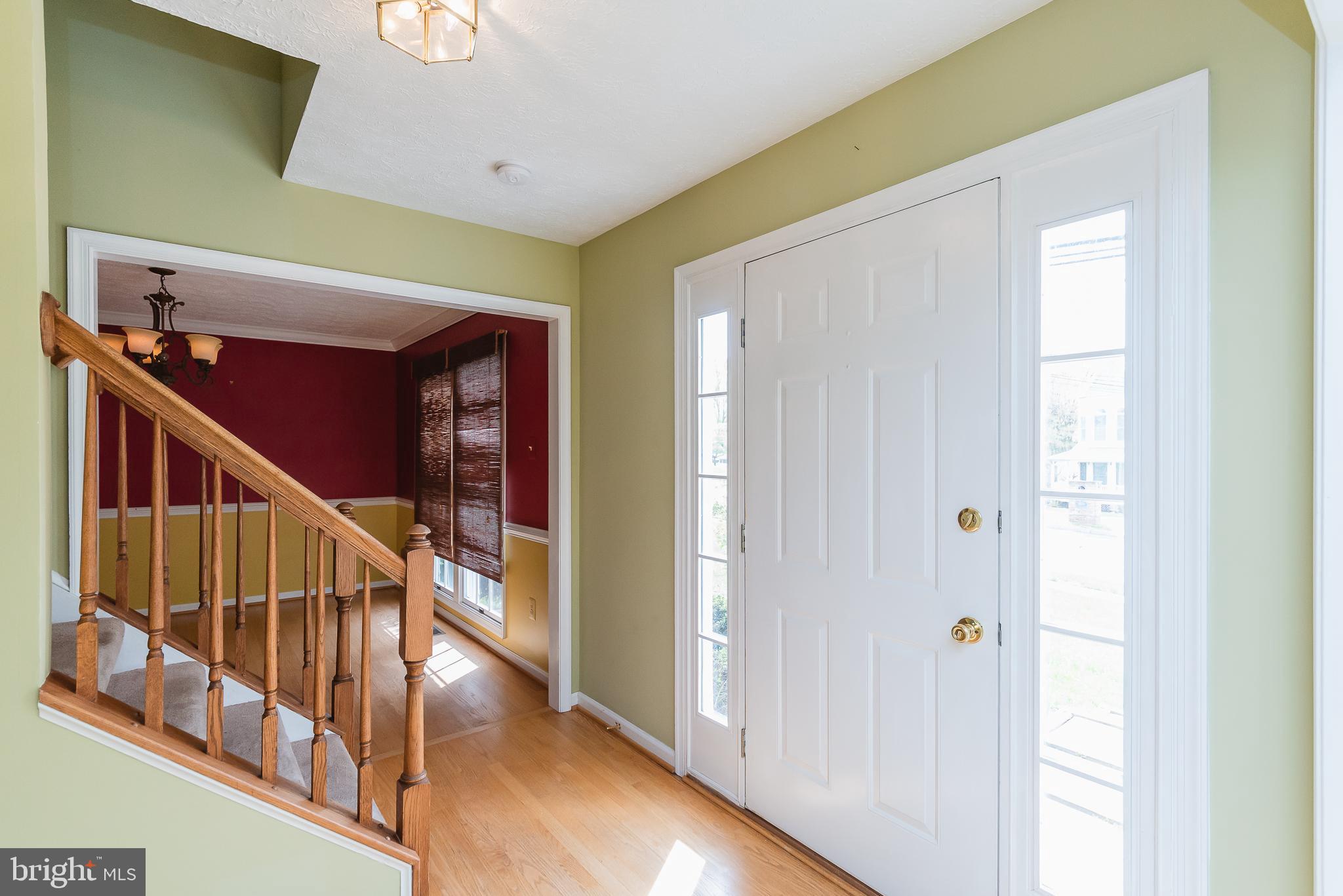 9202 Bretton Reef Road Baltimore, MD 21234 - Photo 3 of 54 Enter center hall foyer with wood floors