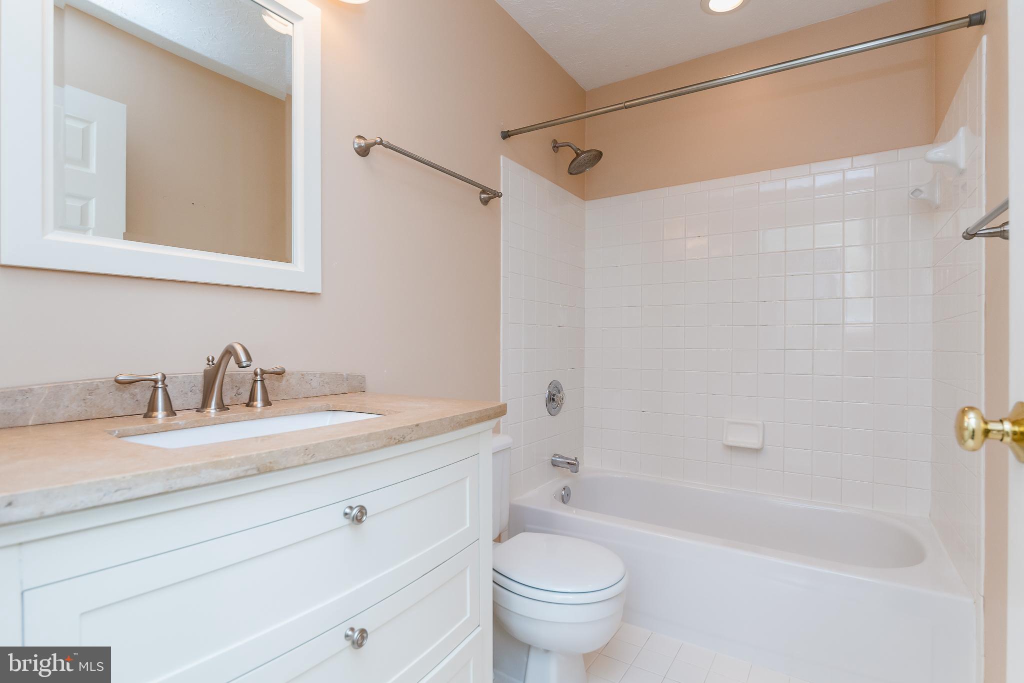 9202 Bretton Reef Road Baltimore, MD 21234 - Photo 22 of 54 Updated hall bath with ceramic floor & surround