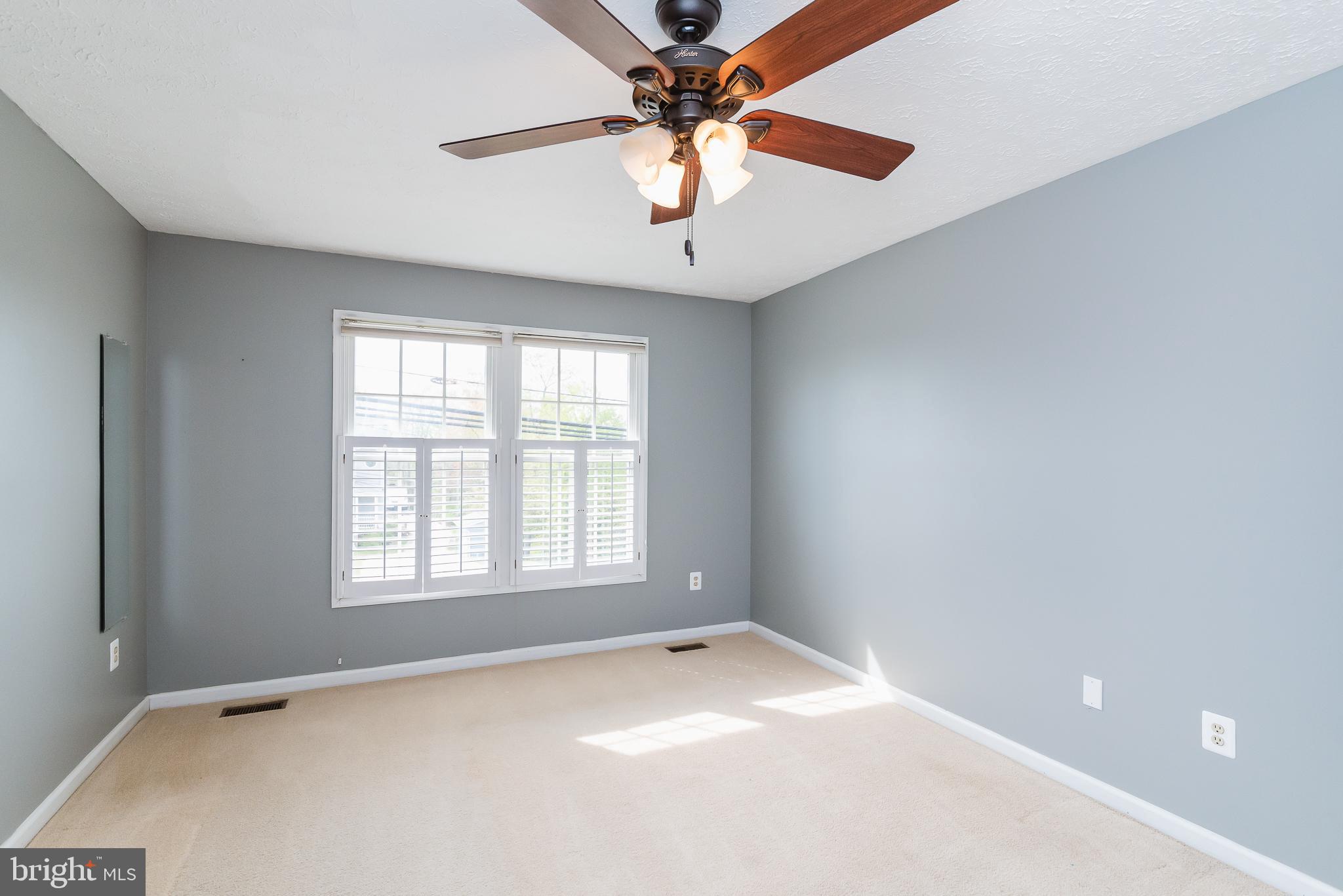 9202 Bretton Reef Road Baltimore, MD 21234 - Photo 23 of 54 Spacious primary bedroom with ceiling fan