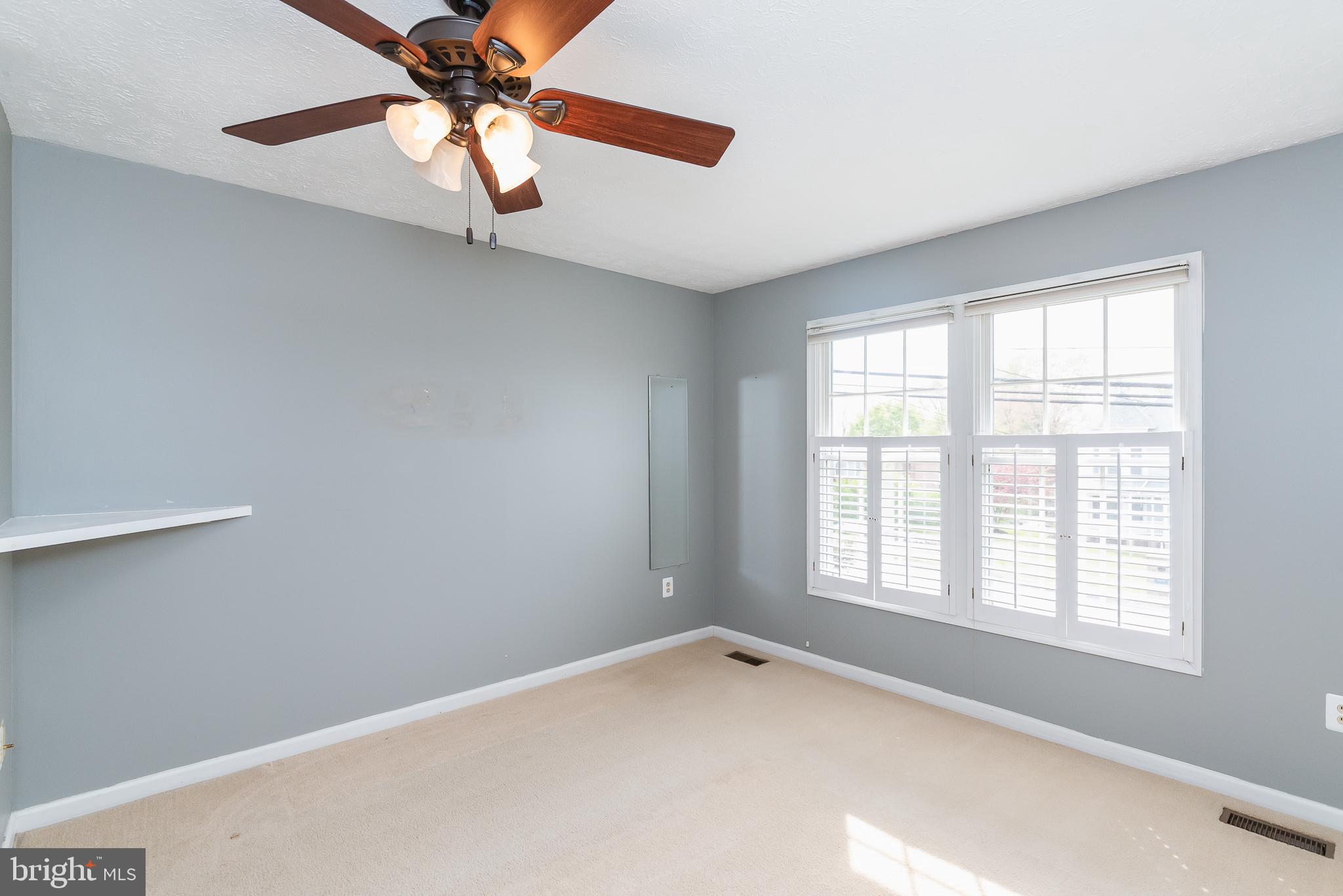 9202 Bretton Reef Road Baltimore, MD 21234 - Photo 24 of 54 Large windows with pantation shutters