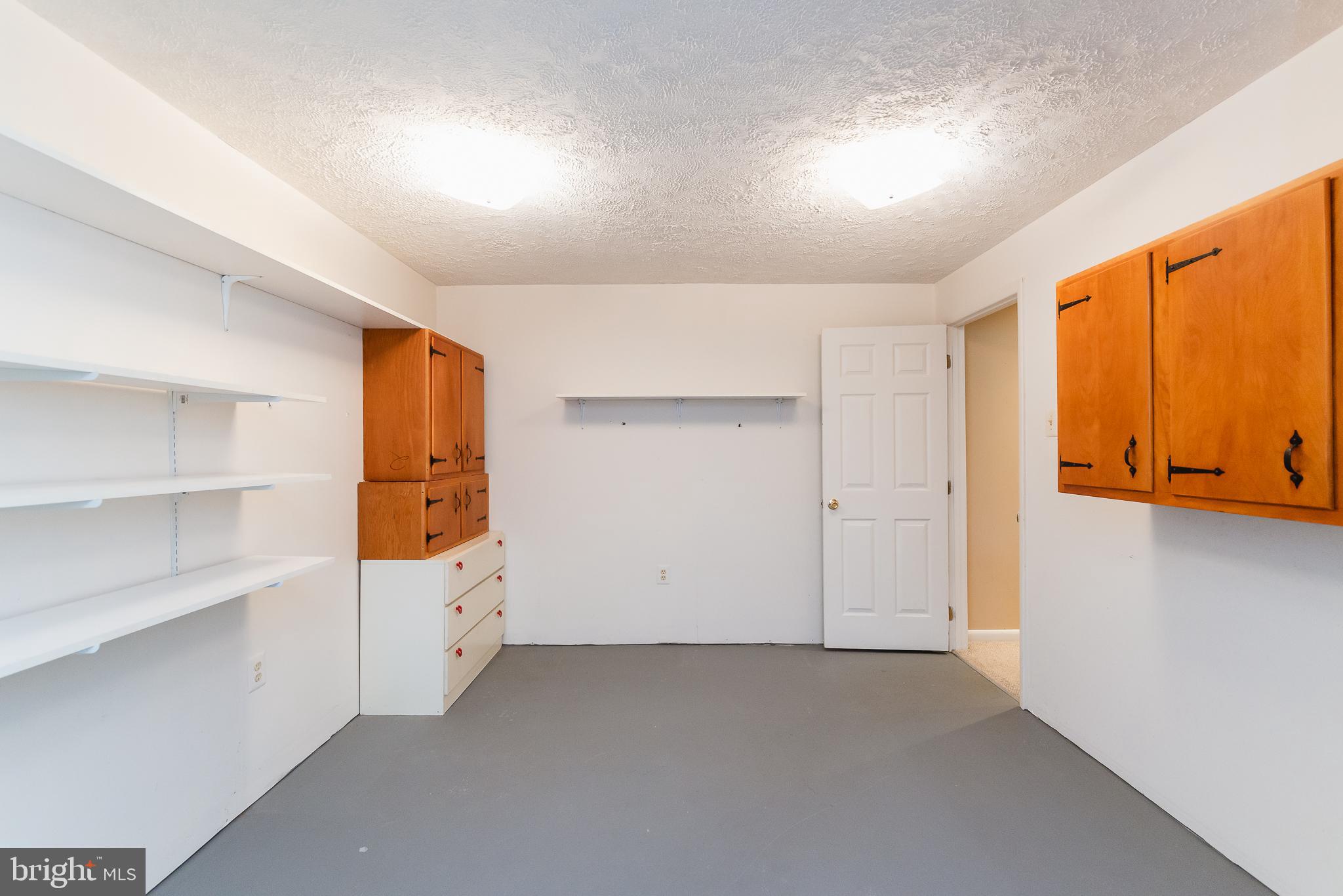 9202 Bretton Reef Road Baltimore, MD 21234 - Photo 45 of 54 Shelving and extra cabinets for storage