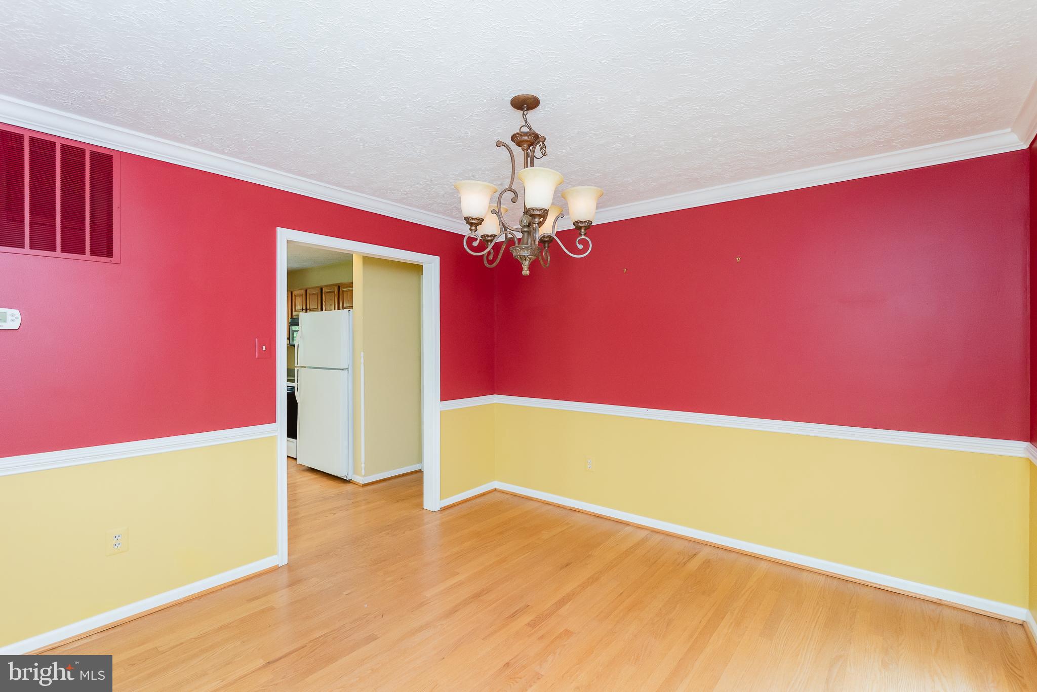 9202 Bretton Reef Road Baltimore, MD 21234 - Photo 9 of 54 Dining room with chair rail and crown moldings
