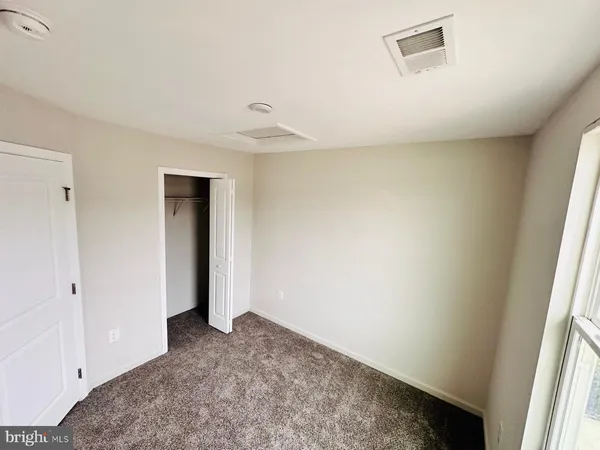 a view of a hallway with closet