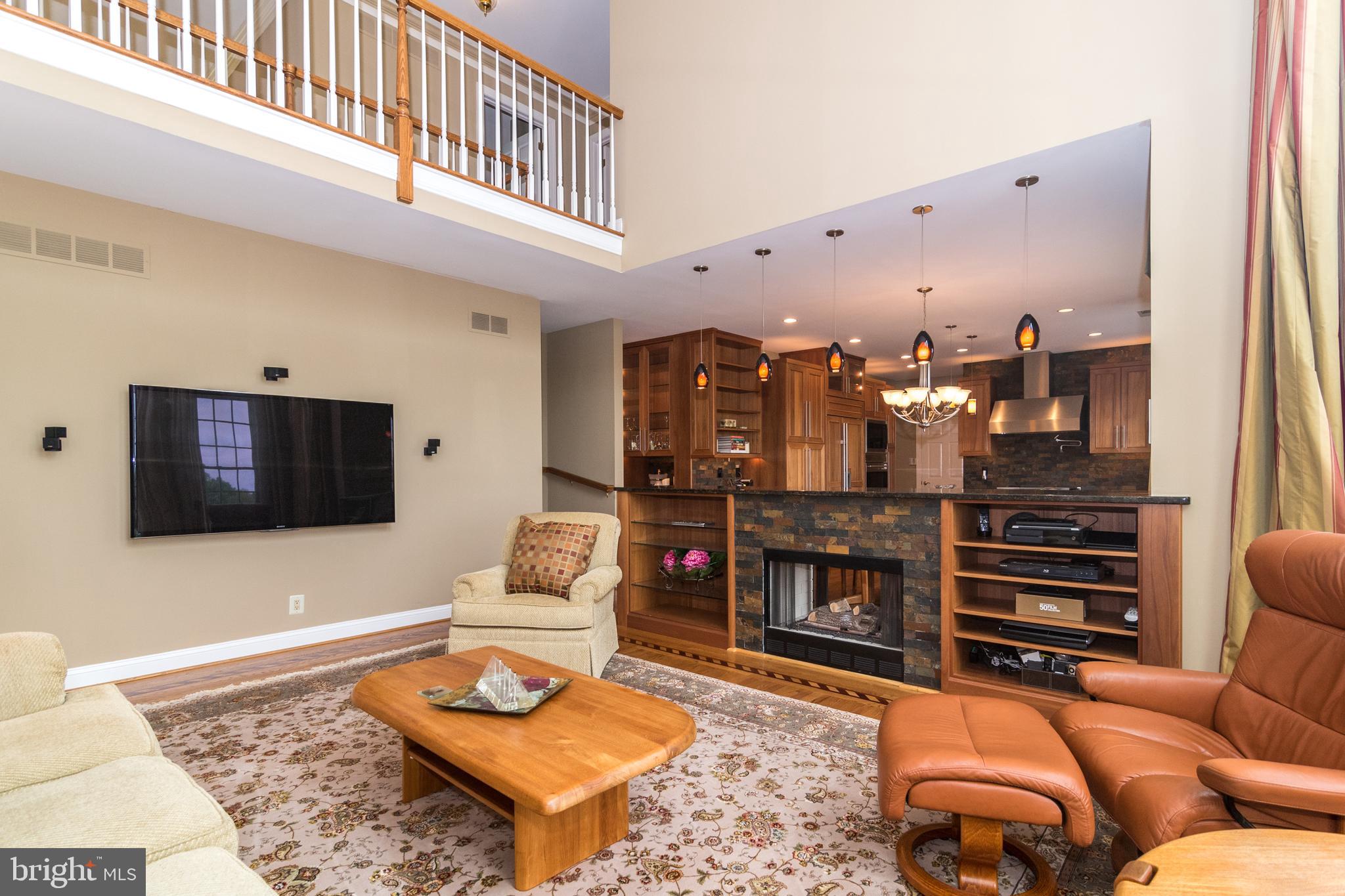 4548 Ridgetop Road Doylestown, PA 18902 - Photo 12 of 41 Family room open to kitchen with fireplace "bar"