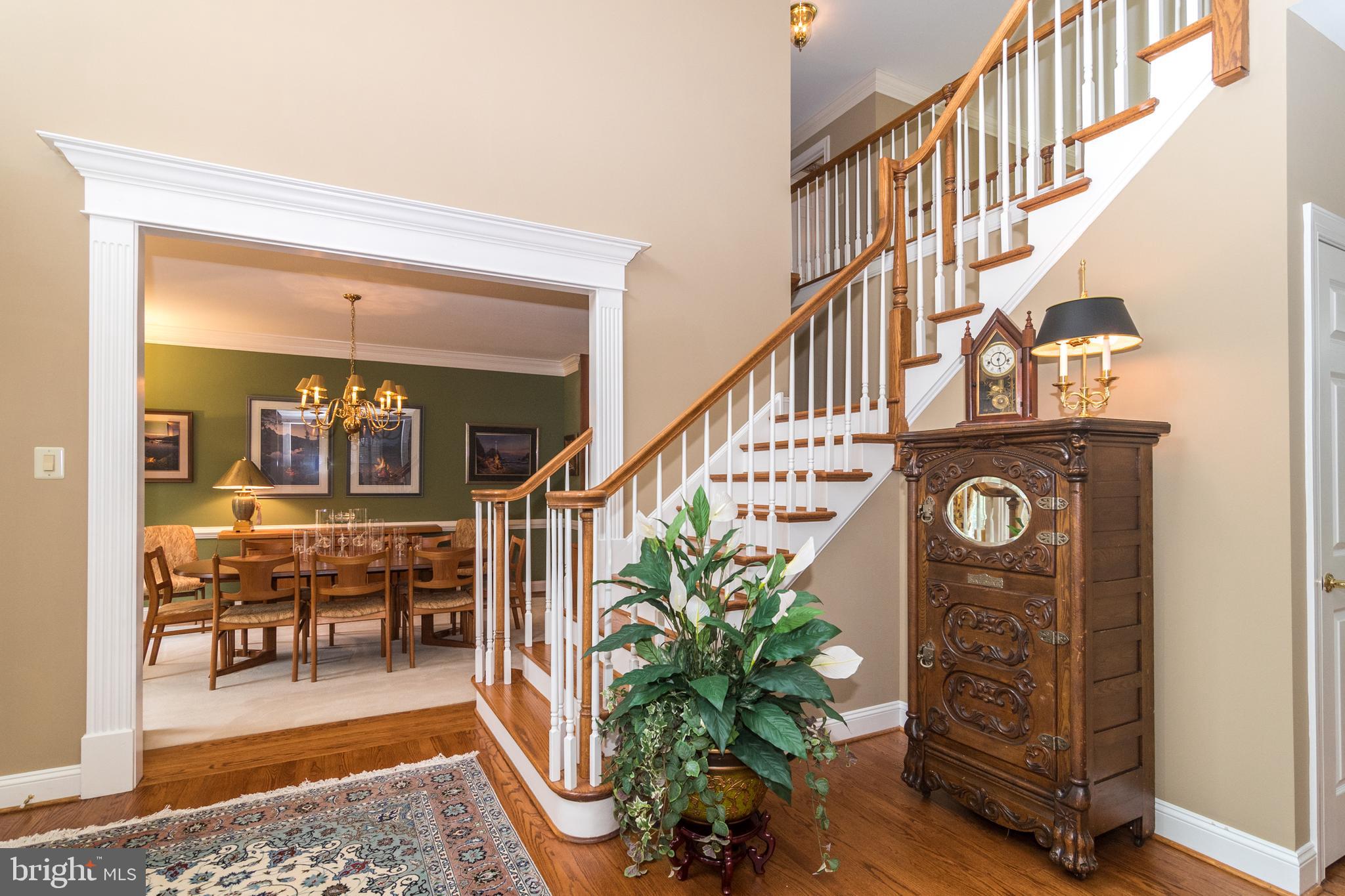 4548 Ridgetop Road Doylestown, PA 18902 - Photo 21 of 41 Grand center hall foyer with wood floors and steps