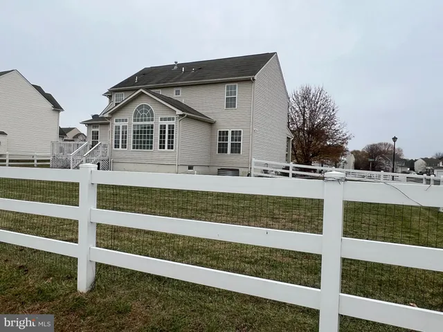 a view of a house with a small yard