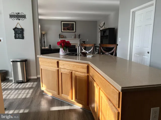 a kitchen with sink refrigerator and microwave