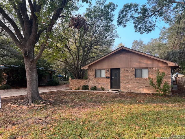 a house with trees in the background